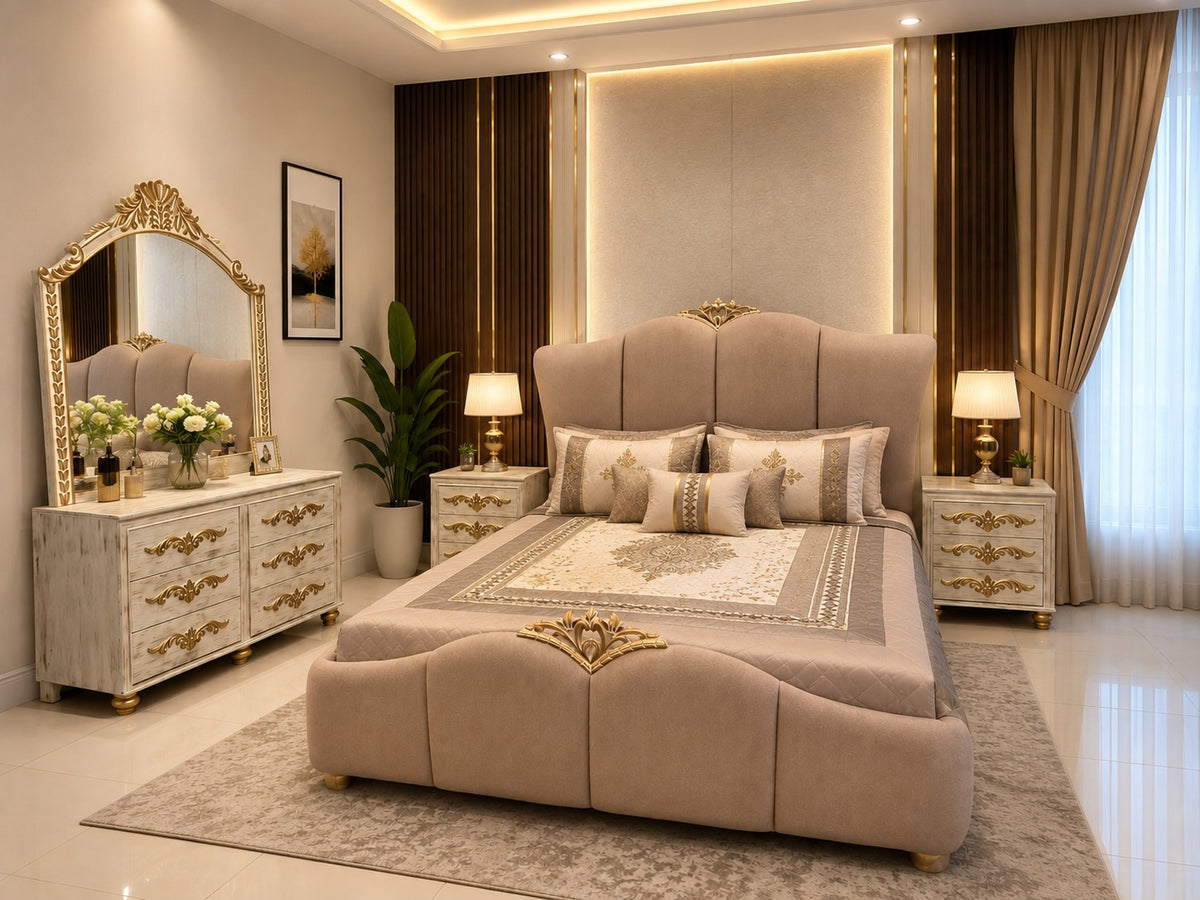 A luxurious bedroom featuring a large upholstered bed in beige with ornate gold detailing, matching nightstands, a cream dresser with gold handles and a large gold-framed mirror, warm ambient lighting, and brown curtains.